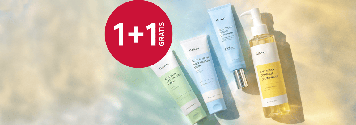 Kosmetyki pielęgnacyjne marki IUNIK w tubkach i butelkach na jasnym tle, obok czerwone koło z hasłem „1+1 gratis”, informujące o promocji na wybrane produkty do pielęgnacji twarzy IUNIK.